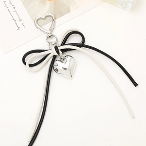 Fashionable leather bow pendant with silver heart charm for bags and keychains