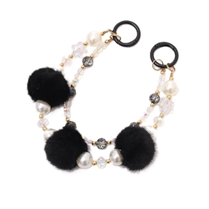 Chaîne à pompons noirs en peluche et perles avec maillons dorés et anneaux ressort