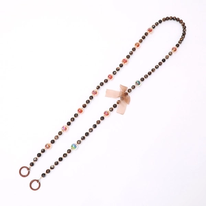 Crossbody pearl crystal beaded phone lanyard with a brown chiffon bow and dark rings