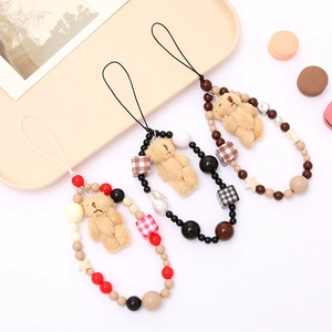 Handmade beaded plush bear phone charms in assorted colors featuring check beads and stars