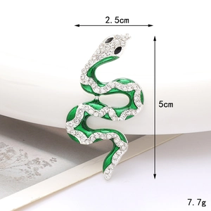Groene emaille slangenbroche met witte zirkonia stenen, afmeting 5 cm x 2,5 cm