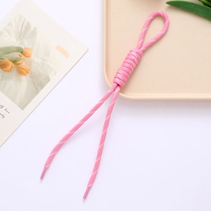 Pink braided rope phone strap with roman knot and white stitching on a neutral tray