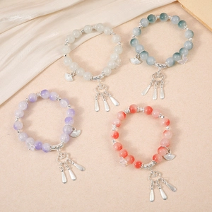 Traditional Chinese style beaded bracelets with colorful jade glass beads and silk tassels