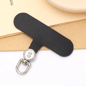 Universal phone tether tab with high density black fabric and silver dollar sign metal clip