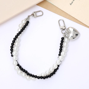 Dual-strand pearl and black beaded phone charm with silver heart pendant and metal clasps