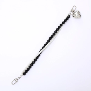 Double-strand beaded phone chain with black and pearl beads and silver heart pendant