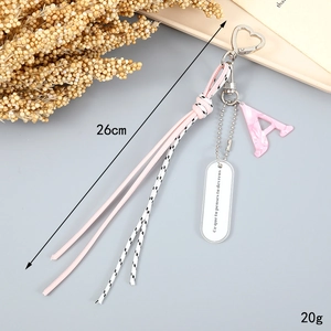 Pink braided rope keychain with letter A marble pendant and heart-shaped metal clip