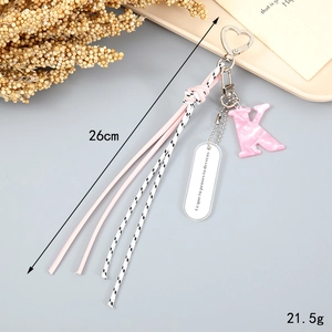 Detailed pink braided keychain with marble letter K, heart buckle, 26cm length and 21.5g