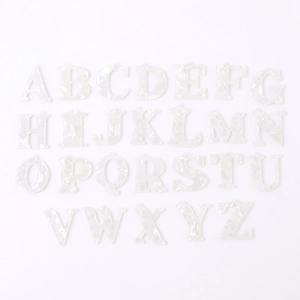 Detail view of 26-piece white marble acrylic A-Z letter charms for DIY jewelry making