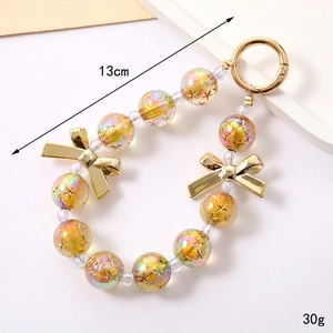 Iridized acrylic bead keychain with stars and bow charms, 13cm length, golden iridescent