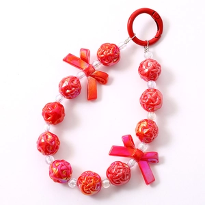Pink acrylic beaded phone strap with rose beads, bows, and a red metal spring hook