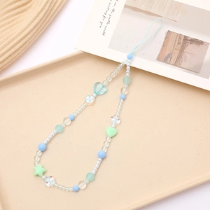 Detail of candy-colored acrylic beads phone strap with frosted heart and star charms