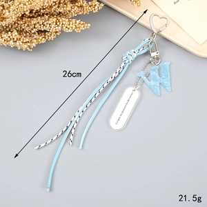 Detail view of woven light blue rope keychain with letter W marble pendant, 26cm length