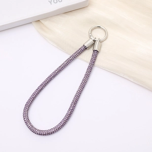 Detail of purple rhinestone braided lanyard with silver circular metal lobster clasp