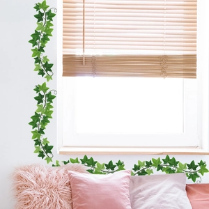 Green ivy leaf wall decals for home decor shown on white walls and window ledge