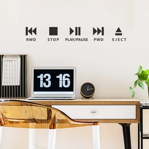 Minimalist black music media player button wall stickers for home decor in a modern office setup