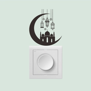 Detail of black Ramadan moon and mosque wall sticker above a light switch cover