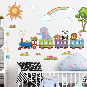 Nursery wall decals featuring cartoon animals on a train with rainbows and sun