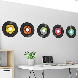Set of five retro vinyl record wall stickers in a modern minimalist bedroom setting