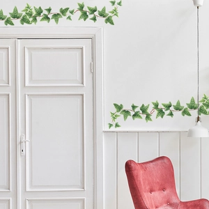 Detailed view of artificial ivy leaf wall stickers with realistic veins on white door