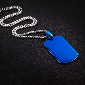 Detailed view of rectangular blue titanium steel dog tag pendant with silver box chain