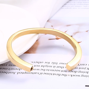 Minimalist gold stainless steel cremation urn bracelet with polished mirror finish
