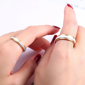 Romantic gold and white brushed stainless steel wedding band for couples on hand