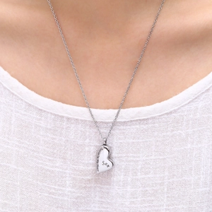 Detail of silver heart urn necklace engraved with Son Forever In My Heart for memorial