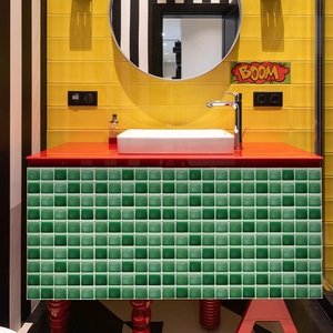 Detail showing green mosaic tile stickers applied on a bathroom cabinet surface