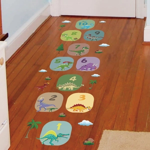 Close-up of colorful dinosaur hopscotch floor stickers with numbered squares for kids