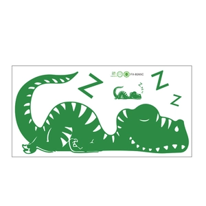 Détail macro du sticker mural dinosaure vert avec symbole de sommeil et bords lisses et nets