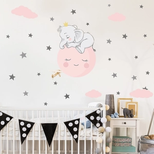 Detail of cartoon elephant sleeping on a pink moon wall sticker with clouds and stars