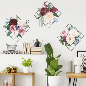 Modern black mesh grid wall decor with vibrant peony and rose floral arrangements