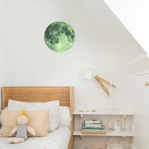 Luminous 40cm moon wall sticker glowing in a cozy bedroom setting with realistic textures
