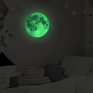 Detailed view of glow in the dark lunar wall sticker with realistic moon texture in a bedroom
