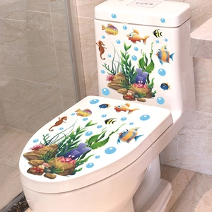 Detail of colorful cartoon sea life stickers applied to a white ceramic toilet tank