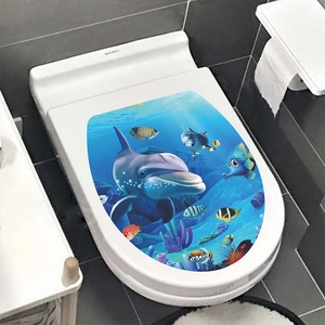Detail view of 3D underwater world toilet lid sticker with dolphins and tropical fish