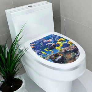 Close-up of tropical fish and coral reef toilet seat sticker on a white lid