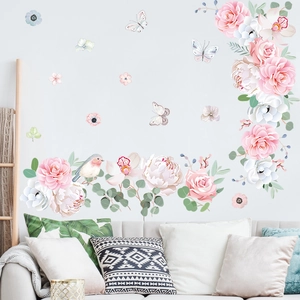 Floral wall stickers with pink roses and butterflies for a fresh bedroom decoration