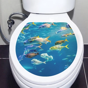 Detail view of underwater world toilet seat sticker with vibrant tropical fish on white cover