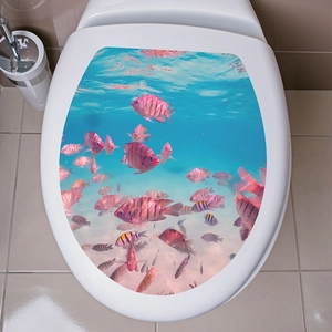 Detail of ocean fish pattern toilet lid sticker with tropical pink fish swimming in blue sea