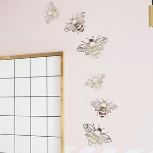 Set of 3D metallic hollow bee wall stickers in brushed gold for home festive decoration