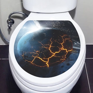Detail view of a waterproof self-adhesive toilet sticker featuring a cosmic planet Earth design