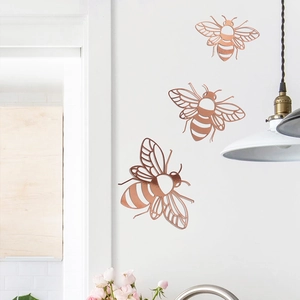 Set of 3 hollow 3D bee wall stickers in rose gold finish for home party decoration