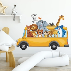 Detail view of yellow school bus wall decal with cartoon animals for kids room
