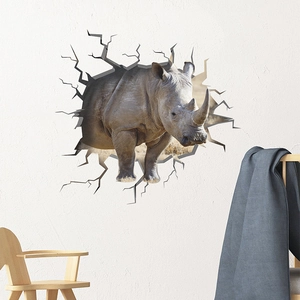 3D wall sticker featuring a fierce grey rhino breaking through a white room wall decoration