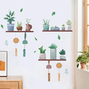 Adesivi murali con piante succulente e nappe appese per la decorazione della cameretta