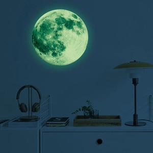 Detailed glowing lunar surface texture of self-adhesive 30cm moon wall sticker in dark room