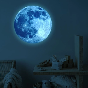 Luminous blue moon wall sticker with realistic crater texture in a dark bedroom setting