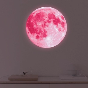 Detailed view of pink glowing moon wall sticker with realistic lunar craters and surface